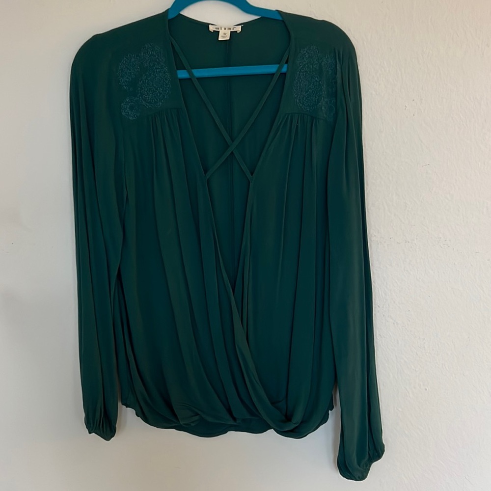Teal long sleeve, very low cut. Like new. Size medium